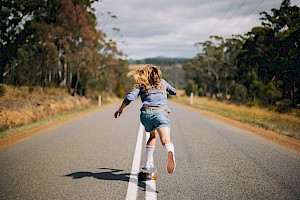 This colour photo shows a female on an adventure amongst mountains by James Bowden, UK  photographer, represented by Horton-Stephens photographer’s agents specialises in natural and authentic  lifestyle outdoors nature photographic images.