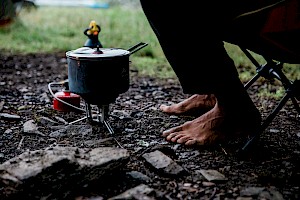 ames Bowden, UK  photographer, represented by Horton-Stephens photographer’s agents specialises in natural and authentic  lifestyle outdoors nature photographic images, this colour photo shows wild camping for outdoor fashion brand