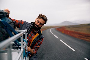 This colour photo shows an adventurer camping for an outdoor clothing brand by James Bowden, UK  photographer, represented by Horton-Stephens photographer’s agents specialises in natural and authentic  lifestyle outdoors nature photographic images.