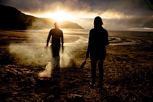 This colour photo shows a sunset landscape scene on a beach by James Bowden, UK  photographer, represented by Horton-Stephens photographer’s agents specialises in natural and authentic  lifestyle outdoors nature photographic images.