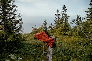 James Bowden, UK  photographer, represented by Horton-Stephens photographer’s agents specialises in natural and authentic  lifestyle outdoors nature photographic images, this colour photo shows a female model outdoors in mountains on an adventure