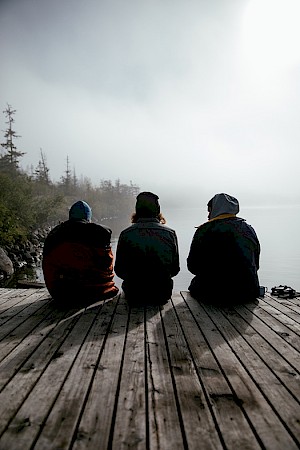 ames Bowden, UK  photographer, represented by Horton-Stephens photographer’s agents specialises in natural and authentic  lifestyle outdoors nature photographic images, this colour photo shows  friends camping outdoors amongst the landscape