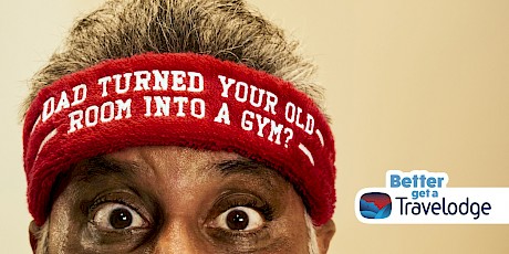 Dad turned your room into a gym written on a red headband campaign for Travelodge photographed by Gary Salter represented by agents Horton-Stephens