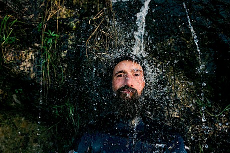bearded man in water shot by James Bowden top outdoor and lifestyle photographer represented by Horton Stephens agency