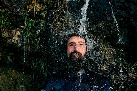 bearded man in water shot by James Bowden top outdoor and lifestyle photographer represented by Horton Stephens agency