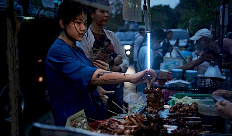 portrait of a  woman in bangkok market shot by Florian Geiss best London photographer with Horton-Stephens photography agency